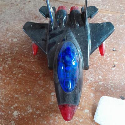 Two toy airplanes - MGA Entertainment - and Vintage roaring Tom cat Tom jet
