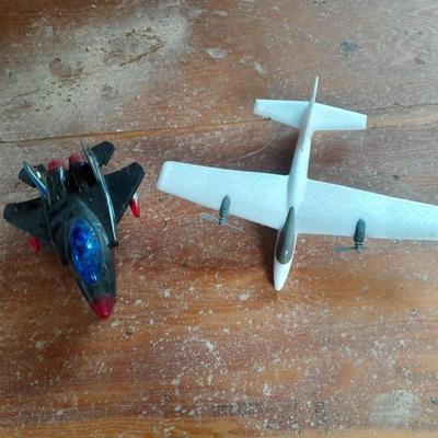 Two toy airplanes - MGA Entertainment - and Vintage roaring Tom cat Tom jet