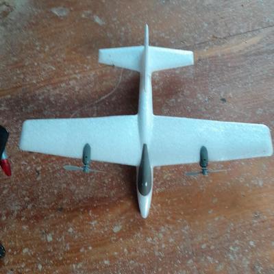Two toy airplanes - MGA Entertainment - and Vintage roaring Tom cat Tom jet