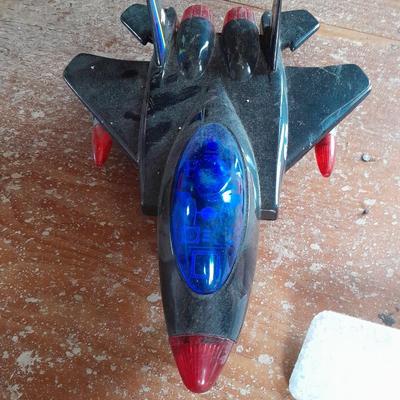 Two toy airplanes - MGA Entertainment - and Vintage roaring Tom cat Tom jet