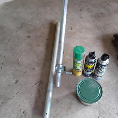 Patio Umbrella with OFF can bug away - cans of Hornet /Wasp spray and a tarp