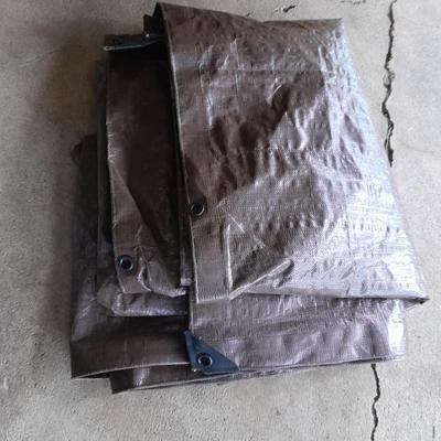 Patio Umbrella with OFF can bug away - cans of Hornet /Wasp spray and a tarp