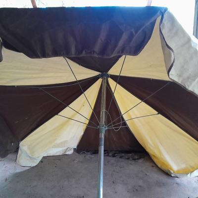 Patio Umbrella with OFF can bug away - cans of Hornet /Wasp spray and a tarp