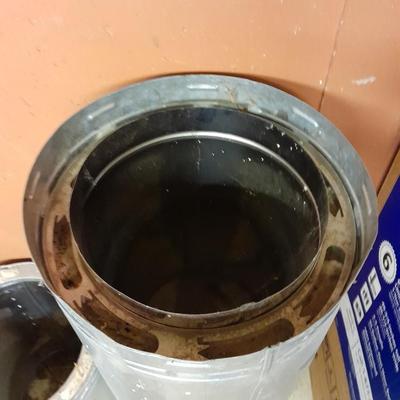 Two pieces of metal fab chimney