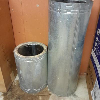 Two pieces of metal fab chimney