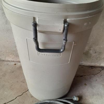 Large Rubbermaid trash can - large extension cord - work gloves