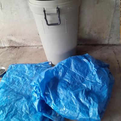 Large Rubbermaid trash can - large extension cord - work gloves