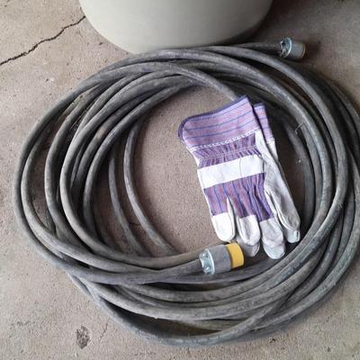 Large Rubbermaid trash can - large extension cord - work gloves
