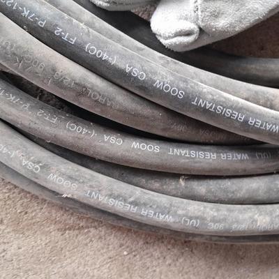 Large Rubbermaid trash can - large extension cord - work gloves