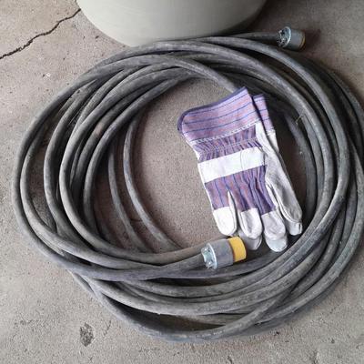 Large Rubbermaid trash can - large extension cord - work gloves