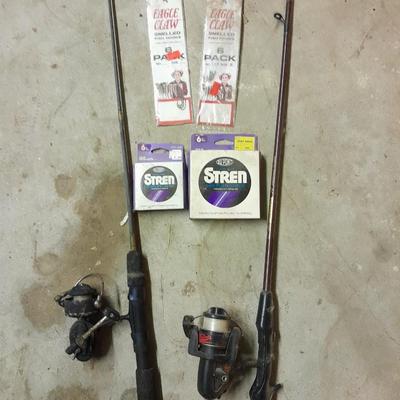 Two fishing poles and a small assortment of fishing line and hooks