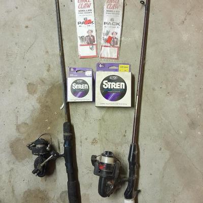 Two fishing poles and a small assortment of fishing line and hooks