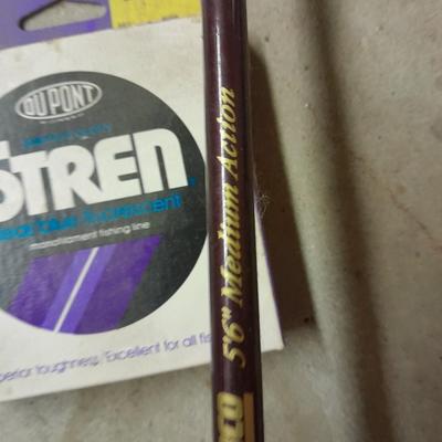 Two fishing poles and a small assortment of fishing line and hooks