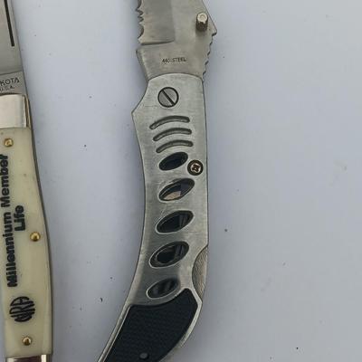 Two Pocket knives - Lakota with advertisement
