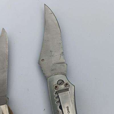 Two Pocket knives - Lakota with advertisement