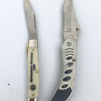 Two Pocket knives - Lakota with advertisement