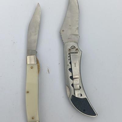 Two Pocket knives - Lakota with advertisement