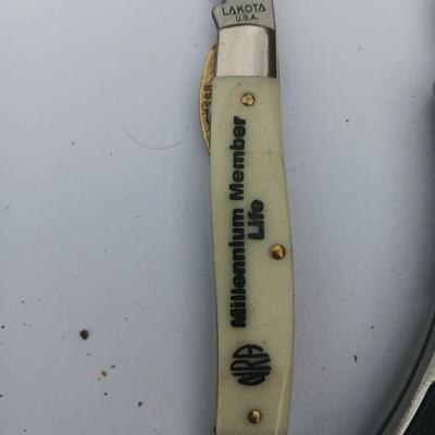 Two Pocket knives - Lakota with advertisement