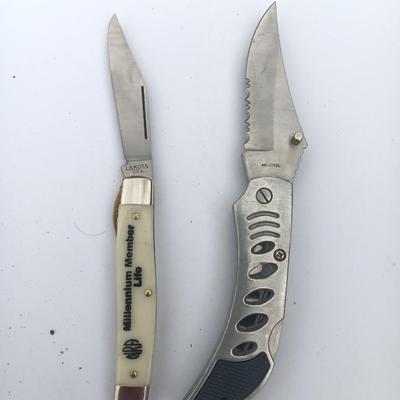 Two Pocket knives - Lakota with advertisement