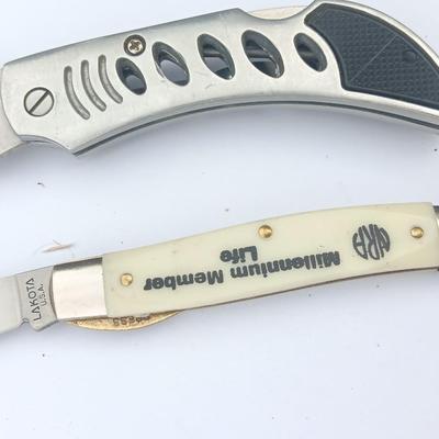 Two Pocket knives - Lakota with advertisement