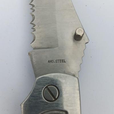 Two Pocket knives - Lakota with advertisement