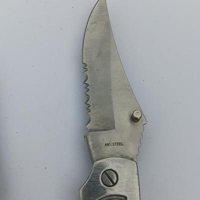 Two Pocket knives - Lakota with advertisement