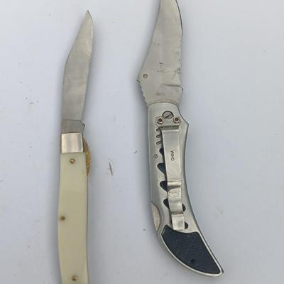 Two Pocket knives - Lakota with advertisement