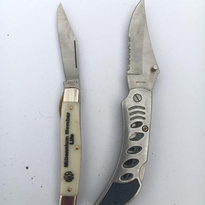 Two Pocket knives - Lakota with advertisement
