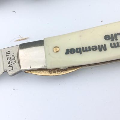 Two Pocket knives - Lakota with advertisement