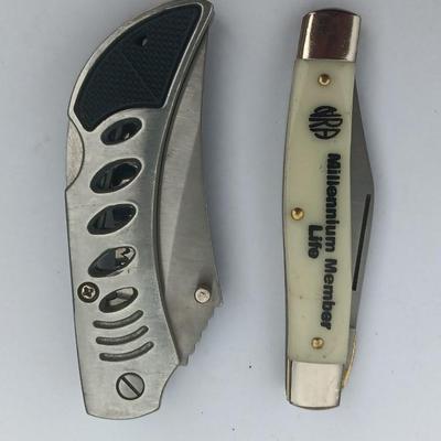 Two Pocket knives - Lakota with advertisement