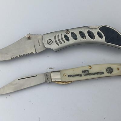 Two Pocket knives - Lakota with advertisement