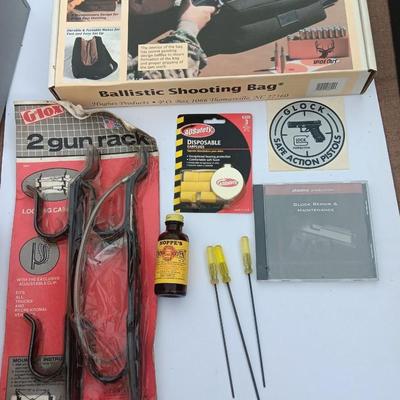 Old new stock Window mount gun rack and a Ballistic shooting bag with gun cleaning items