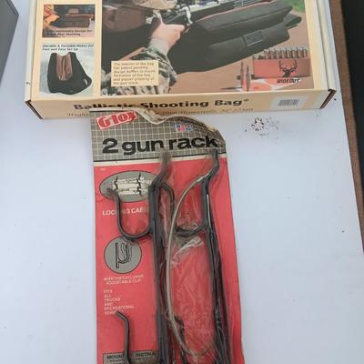 Old new stock Window mount gun rack and a Ballistic shooting bag with gun cleaning items