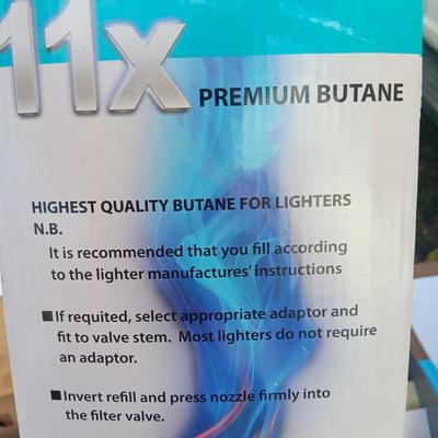 Assortment of household goods - bottles of butane - spray foam - a brush assortment and more