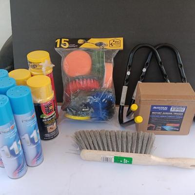 Assortment of household goods - bottles of butane - spray foam - a brush assortment and more