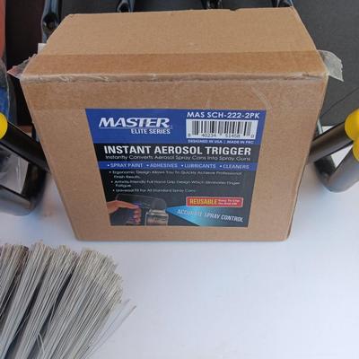 Assortment of household goods - bottles of butane - spray foam - a brush assortment and more