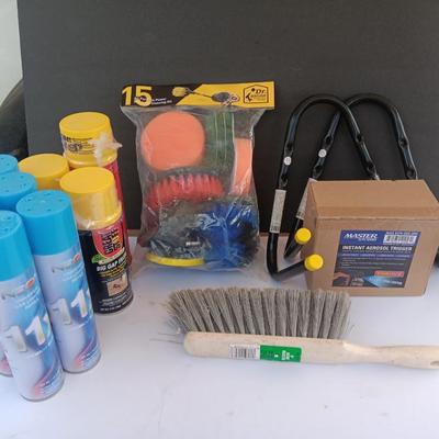 Assortment of household goods - bottles of butane - spray foam - a brush assortment and more