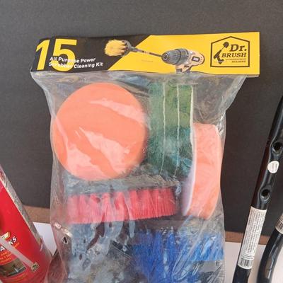 Assortment of household goods - bottles of butane - spray foam - a brush assortment and more