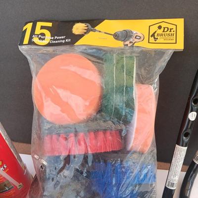Assortment of household goods - bottles of butane - spray foam - a brush assortment and more