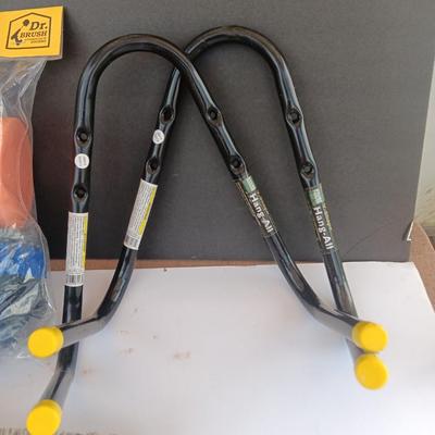 Assortment of household goods - bottles of butane - spray foam - a brush assortment and more