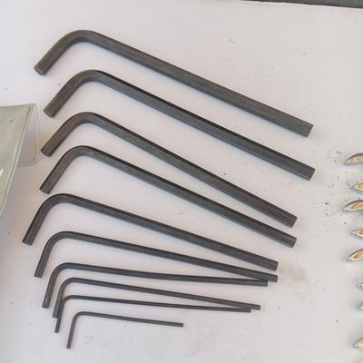 Assortment of little handheld tools - small wrenches - screwdrivers and an Allen wrench set