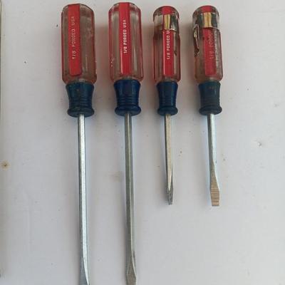 Assortment of little handheld tools - small wrenches - screwdrivers and an Allen wrench set