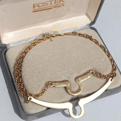 Gold toned "Boss" keychain and two gold toned matching bracelets