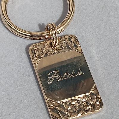Gold toned "Boss" keychain and two gold toned matching bracelets