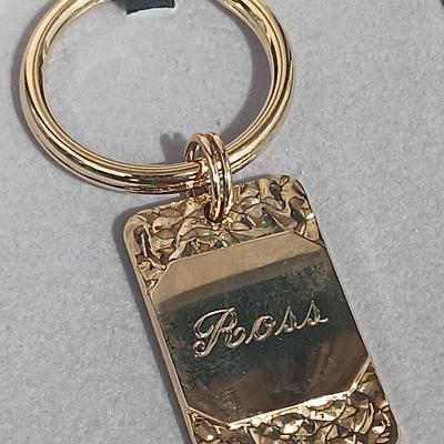 Gold toned "Boss" keychain and two gold toned matching bracelets