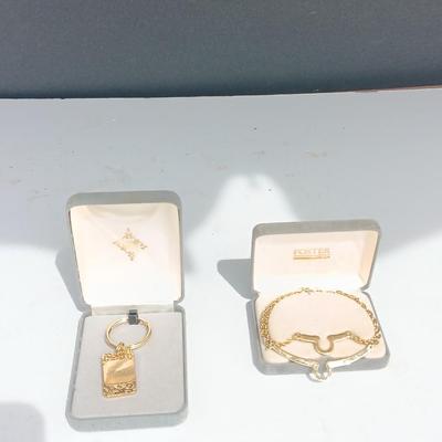 Gold toned "Boss" keychain and two gold toned matching bracelets