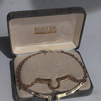 Gold toned "Boss" keychain and two gold toned matching bracelets