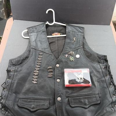 Harley Davidson Size XL Black leather biker vest with a nice collection of Sturgis pins