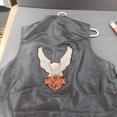 Harley Davidson Size XL Black leather biker vest with a nice collection of Sturgis pins