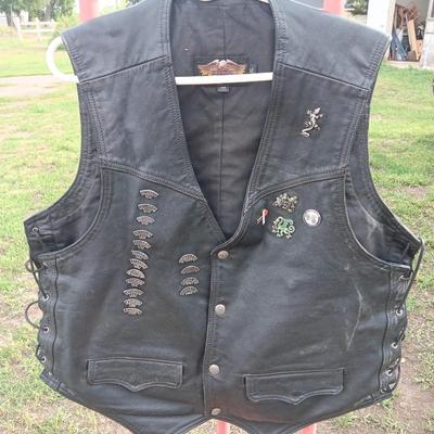 Harley Davidson Size XL Black leather biker vest with a nice collection of Sturgis pins